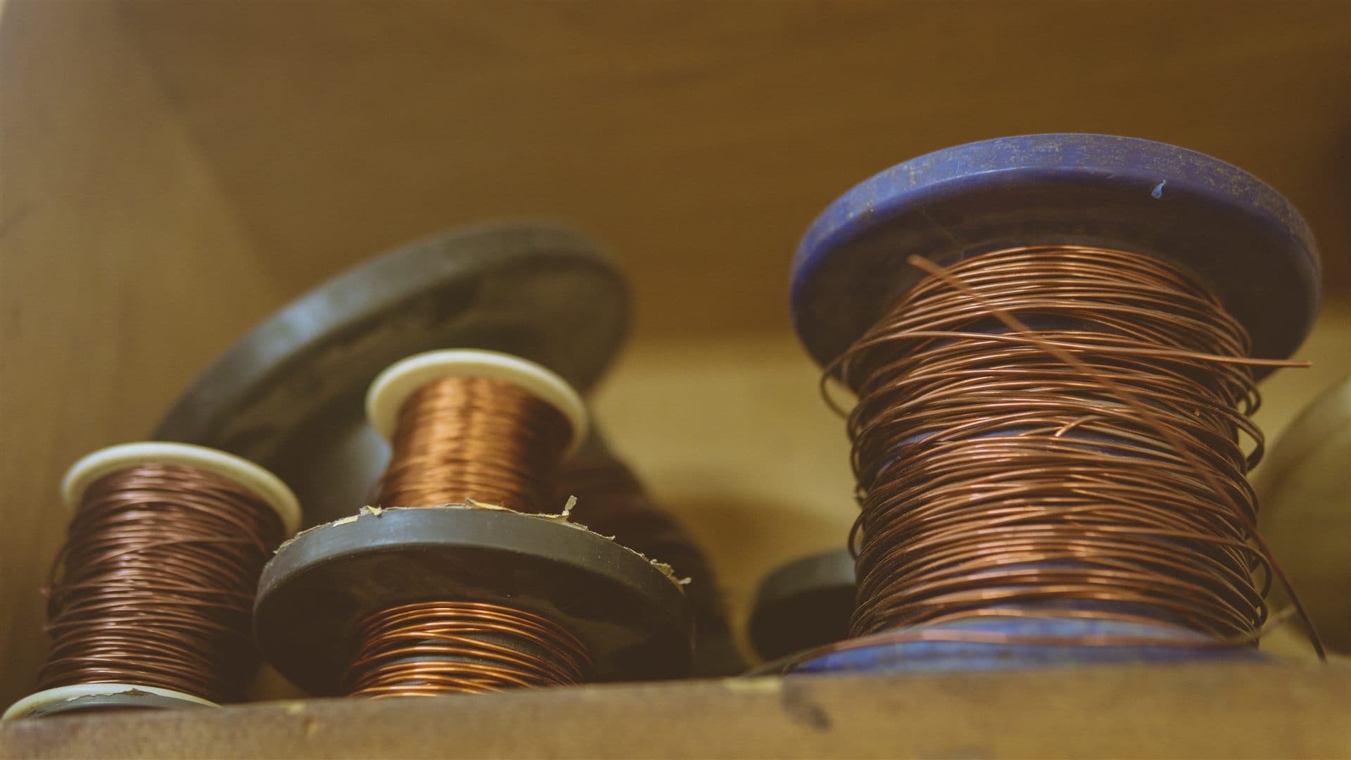 Copper wire spools and piano strings during restoration