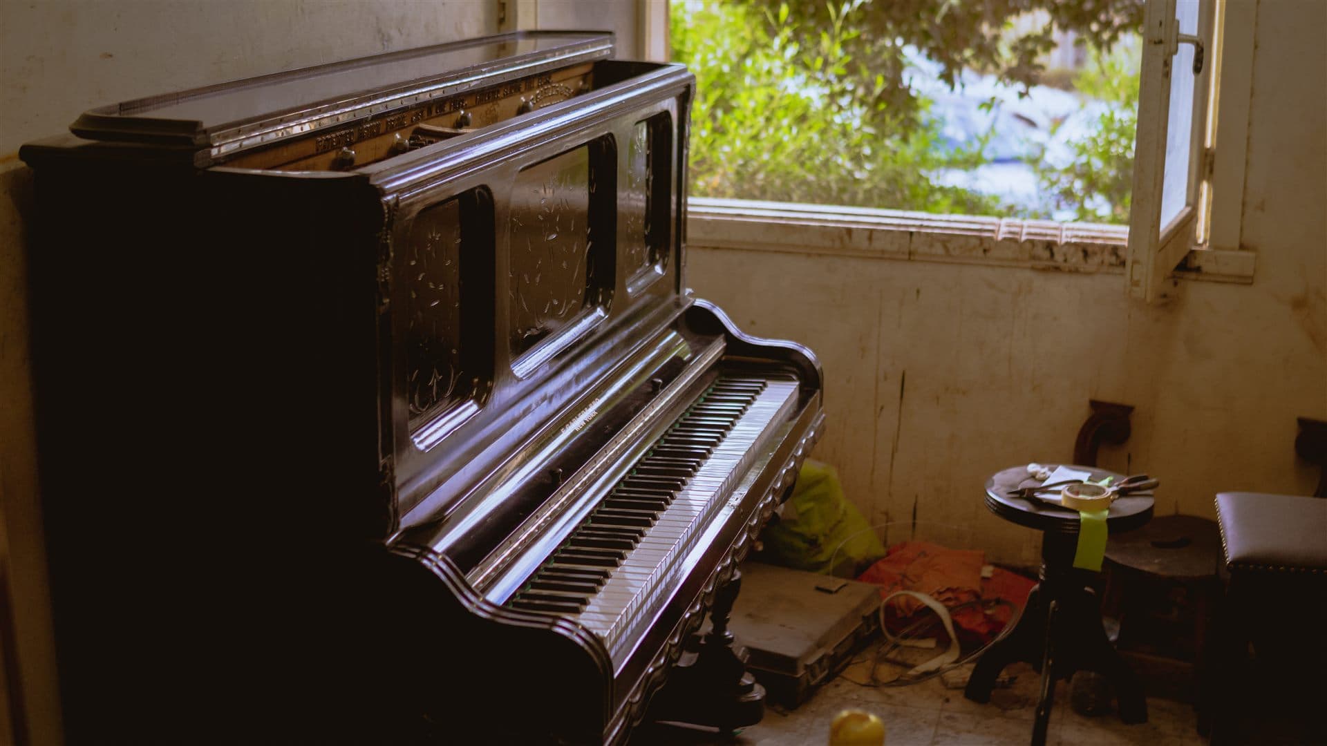 Old upright piano awaiting restoration